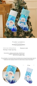Detailed view of LED lighted Christmas stockings with Santa and snowman patterns in blue