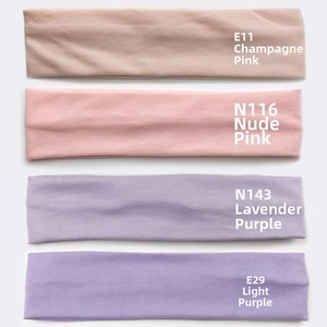 Detailed view of elastic cotton hair bands in champagne pink and purple shades