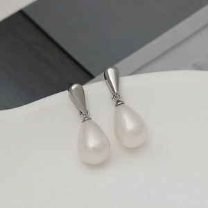 Elegant silver waterdrop pearl earrings with a modern minimalist hanging design