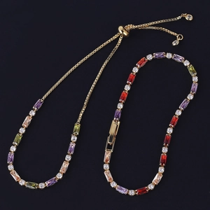 Detailed view of gold bracelets featuring colorful rectangular zircons and diverse clasps