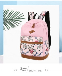 Detail of pink floral backpack with reinforced leather bottom and side water bottle pocket