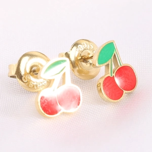 Close-up of cherry stud earrings with red enamel and S.Steel hallmark on butterfly clasp