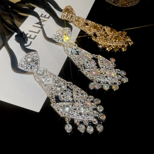 Close-up of sparkling rhinestone necktie fringe necklaces in silver, gold, and AB colors