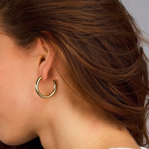 Polished gold-plated C-shaped hoop earrings for women with a minimalist mirror finish