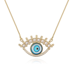 Elegant gold necklace featuring an evil eye pendant with micro-pave crystals on white