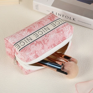 Pink floral PVC makeup bag with large capacity and portable zipper closure for travel