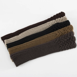 Winter knitted arm warmers in various colors featuring classic cable knit textures