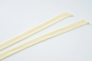 Detail of off-white mesh dress straps with clean stitching and bias-cut ends