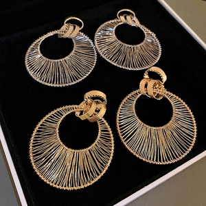 Chunky hollow circular earrings with fine wire wrap texture in gold and silver finish