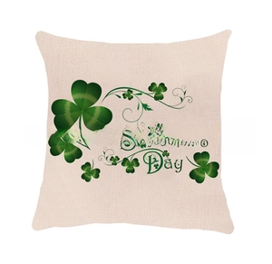 Detail of St. Patrick's Day pillowcase showing green clover print on beige linen texture