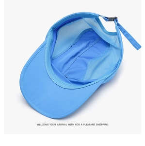 Detail view of breathable mesh and quick-dry fabric on light blue outdoor sun hat