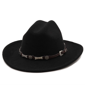 Close-up of black felt cowboy hat with leather band and silver star rivets detailing