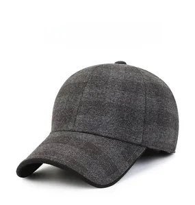 Detail of grey wool baseball cap showing thick texture and Donatello metal emblem