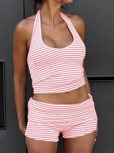 Detail of pink and white striped halter crop top and matching shorts set for women