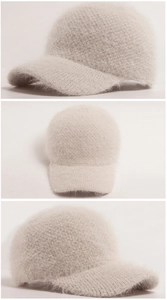 Detailed knit texture and soft faux fur material of the beige winter baseball cap