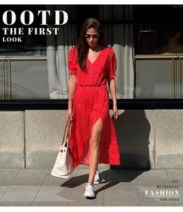 Detail of red polka dot dress with V-neck, button-down front and side slit for summer