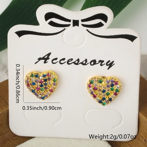 Macro view of gold heart stud earrings with colorful cubic zirconia and dimensions
