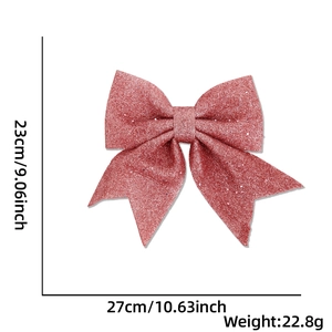 Macro detail of rose pink glitter Christmas bow with 27x23cm dimensions and weight info