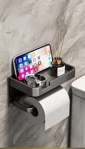 Wall-mounted matte black shelf with phone holder and toilet paper roll hanger