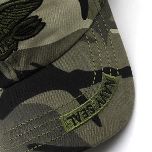 Detailed close-up of Navy Seal embroidery and stitching on a camouflage tactical cap