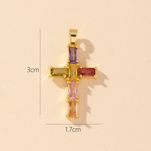 Detail view of a 3cm gold-plated cross pendant with multicolored rectangular zircons