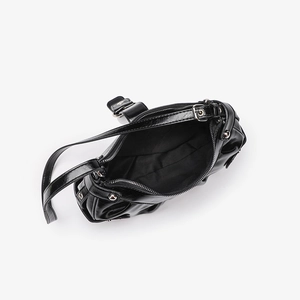 Top-down view of black crocodile pattern shoulder bag showing silver zipper and lining
