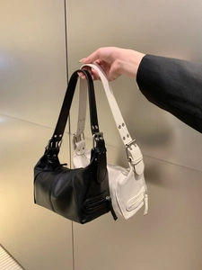 Retro PU leather underarm bags in black and white with zipper pockets and buckle straps