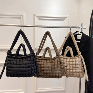 Quilted nylon puffer tote bags in black, beige, and khaki with dual handles and shoulder straps