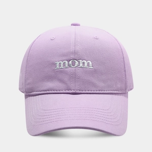 Close-up of white mom embroidery on a lavender cotton baseball cap with fine stitching