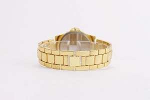 Detailed back view of a gold-tone rhinestone quartz watch with link metal strap