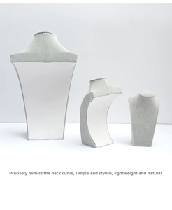 Three-piece set of grey velvet necklace display busts with realistic neck contour design