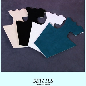Macro detail of folding necklace display busts in beige black white and teal velvet