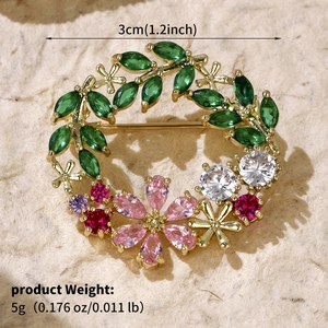 Macro shot of 3cm wheat ear wreath brooch with colorful zircons and weight details
