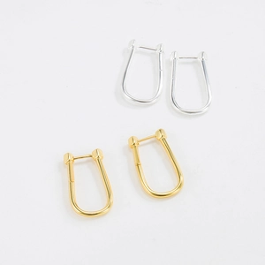 Close-up of S925 sterling silver U-shaped hoop earrings in gold and silver finishes