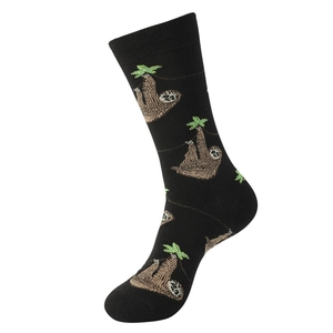 Detail of black crew socks featuring cute cartoon sloth patterns and ribbed cuffs