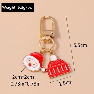Detail of Christmas Santa and hat keychain pendants with precise dimensions and weight info
