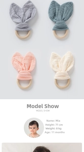 Detail view of cotton muslin bunny ear pacifiers with natural wooden teething rings