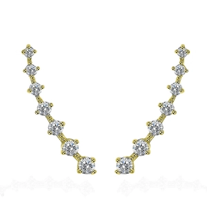 Detailed view of curved gold ear crawlers set with seven sparkling white zircons