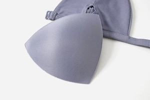Macro detail of ribbed triangle bralette with removable pads in grey purple fabric