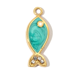 Macro shot of fish-shaped pendant with light blue enamel and sparkling rhinestone tail