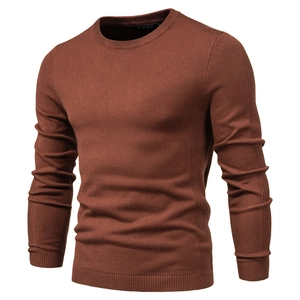 Close-up of the ribbed crew neck and fine knit texture of this slim fit men's sweater