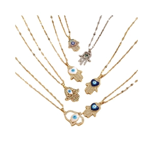 Hamsa Hand and Evil Eye pendant necklaces with colorful cubic zirconia in gold and silver