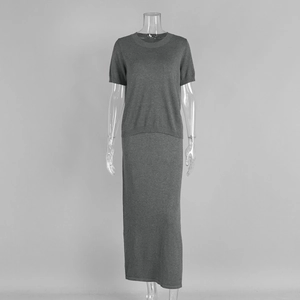 Detail view of grey knit two-piece set featuring short sleeve top and maxi skirt texture
