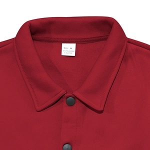 Macro view of red jacket collar showing stitching detail and M size label