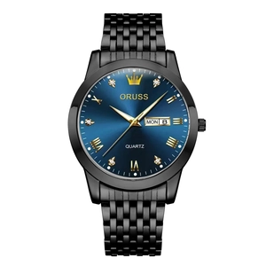 Detailed close-up of blue sunray dial with day-date window and gold indices on black watch