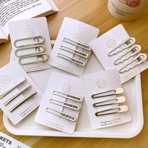 Detailed close-up of a silver Y2K metallic hair clip set featuring geometric hollow designs