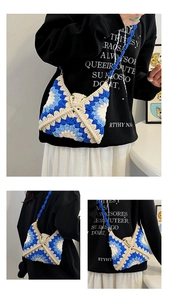 Detail view of handmade crochet crossbody bag with blue and beige wave patterns