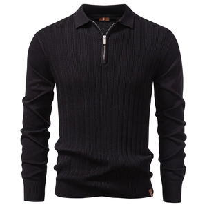 Detail of men's black knit sweater featuring 1/4 zip collar and vertical texture