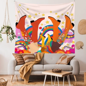 Retro Pop Art tapestry with colorful boots and stars hanging above a sofa in a living room