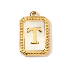 Detail view of a gold rectangular pendant with a white shell inlay and a capital letter T